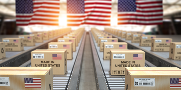 Cardboard boxes with text made in USA and American flag on the roller conveyor